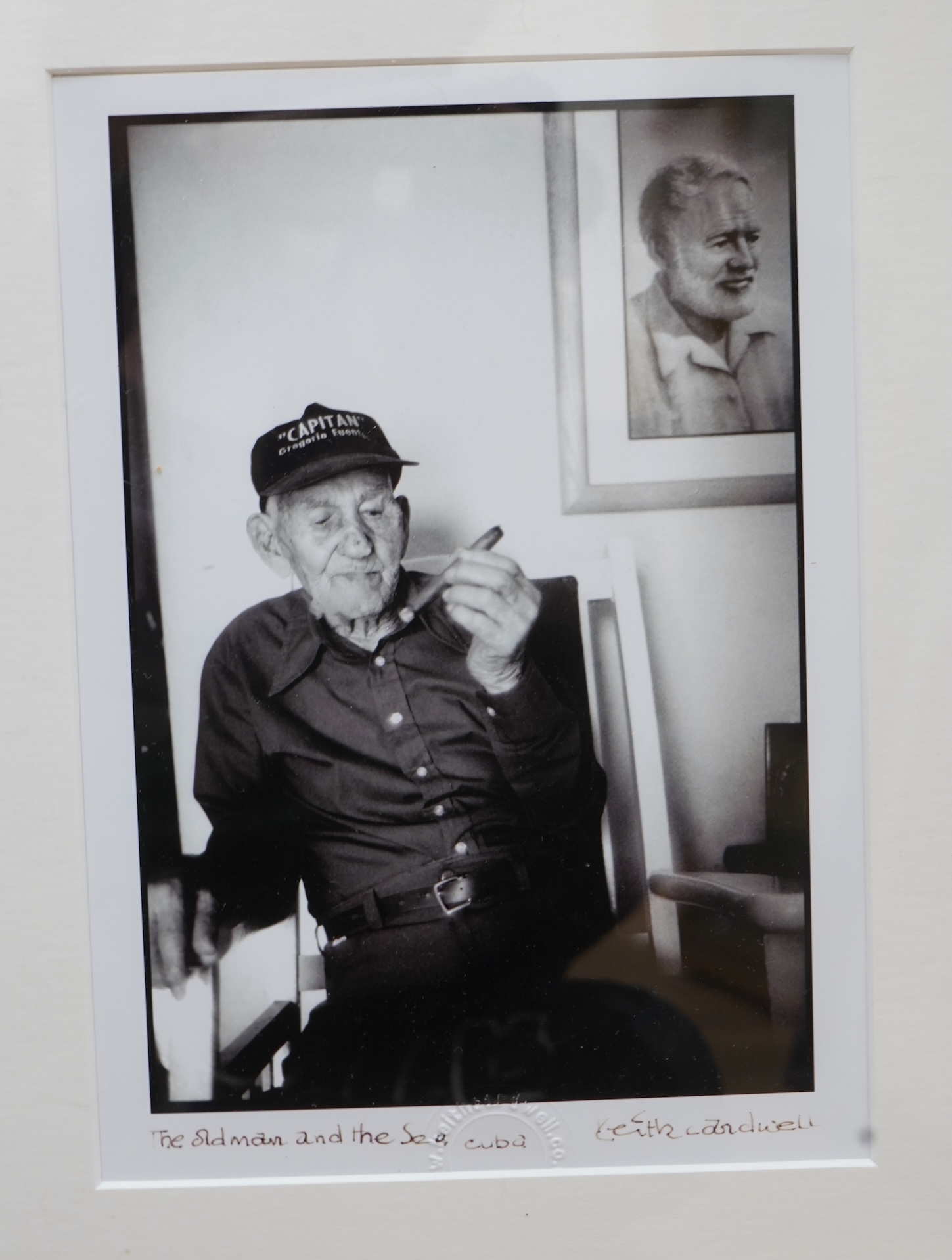 Keith Cardwell (Contemporary), Three gelatin silver prints to include ‘Old Man and the Sea, Cuba’, stamped, signed and titled in ink to the margin and ‘Korda with his Che’, stamped, largest 25 x 17cm, together with a boo